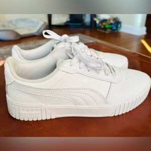 Women’s white Puma sneakers